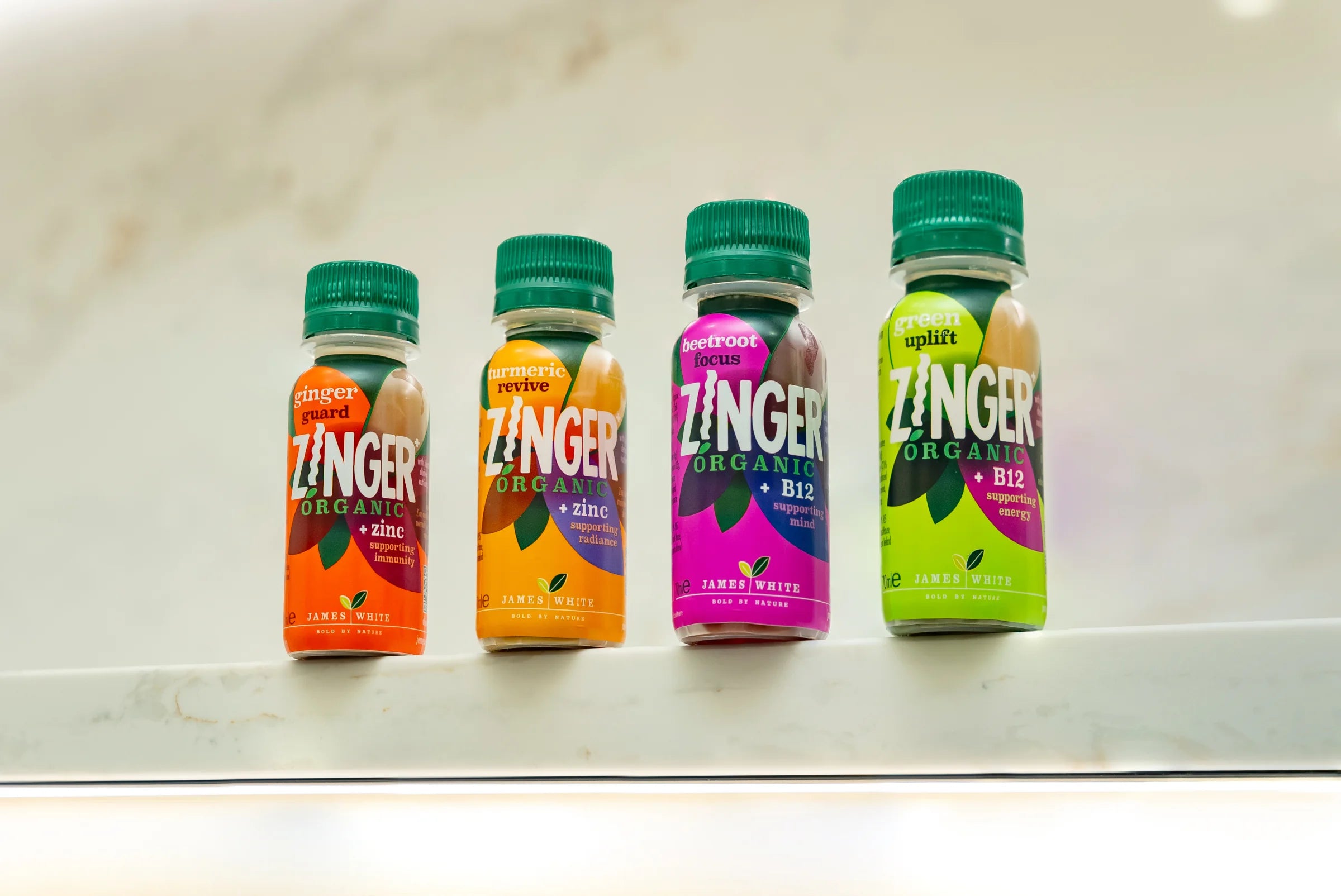 Ginger Guard, Turmeric Revive, Beetroot Focus and Green Uplift shots side by side