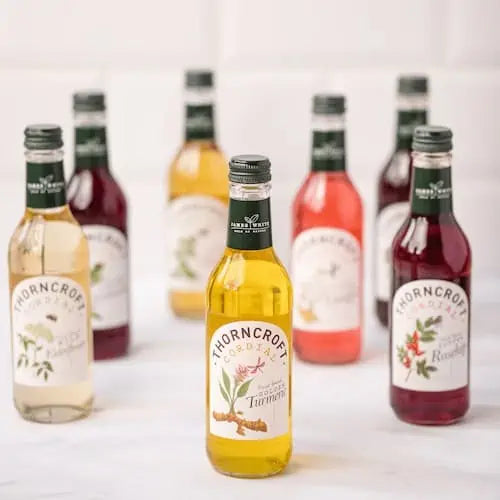 Thorncroft cordial bottles with their distinctive botanical labels